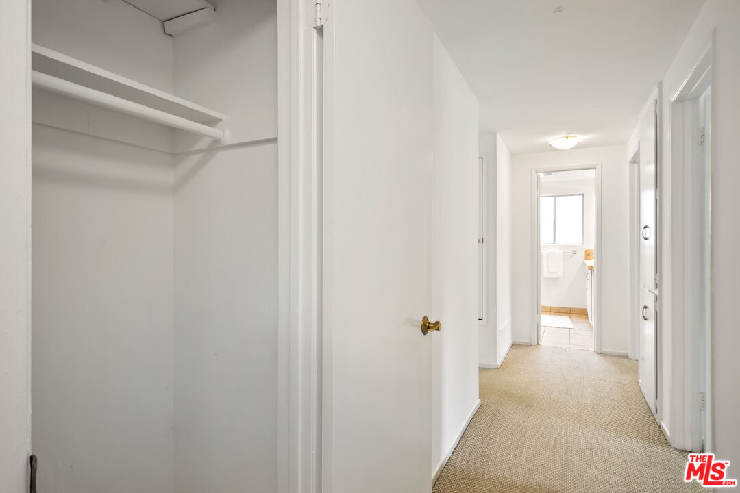 6164 Paseo Cyn Drive Malibu, CA 90265 - Photo 23 of 45 a view of a hallway with wooden floor
