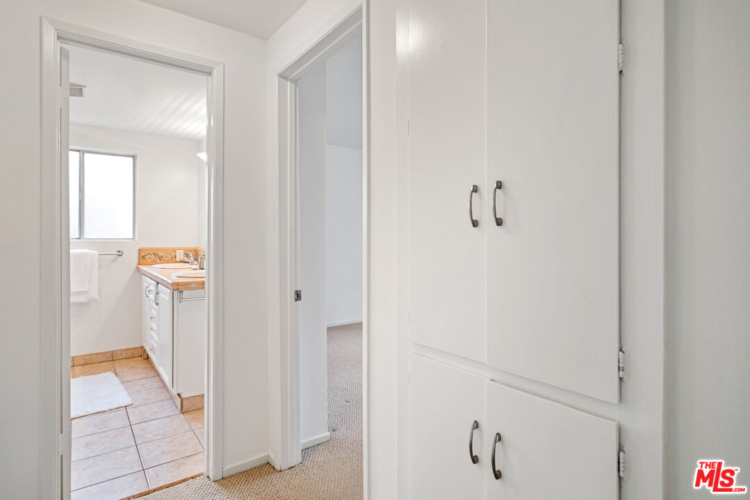 6164 Paseo Cyn Drive Malibu, CA 90265 - Photo 24 of 45 a view of a hallway with closet and bathroom