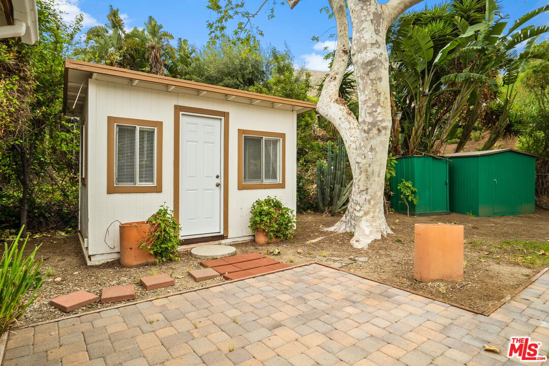 6164 Paseo Cyn Drive Malibu, CA 90265 - Photo 40 of 45 a front view of a house with garden