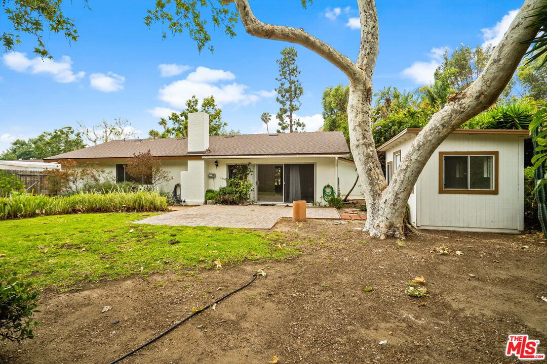 6164 Paseo Cyn Drive Malibu, CA 90265 - Photo 41 of 45 a front view of a house with a garden