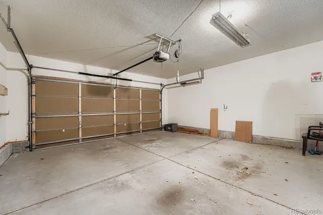a view of a room with gym equipment and a window