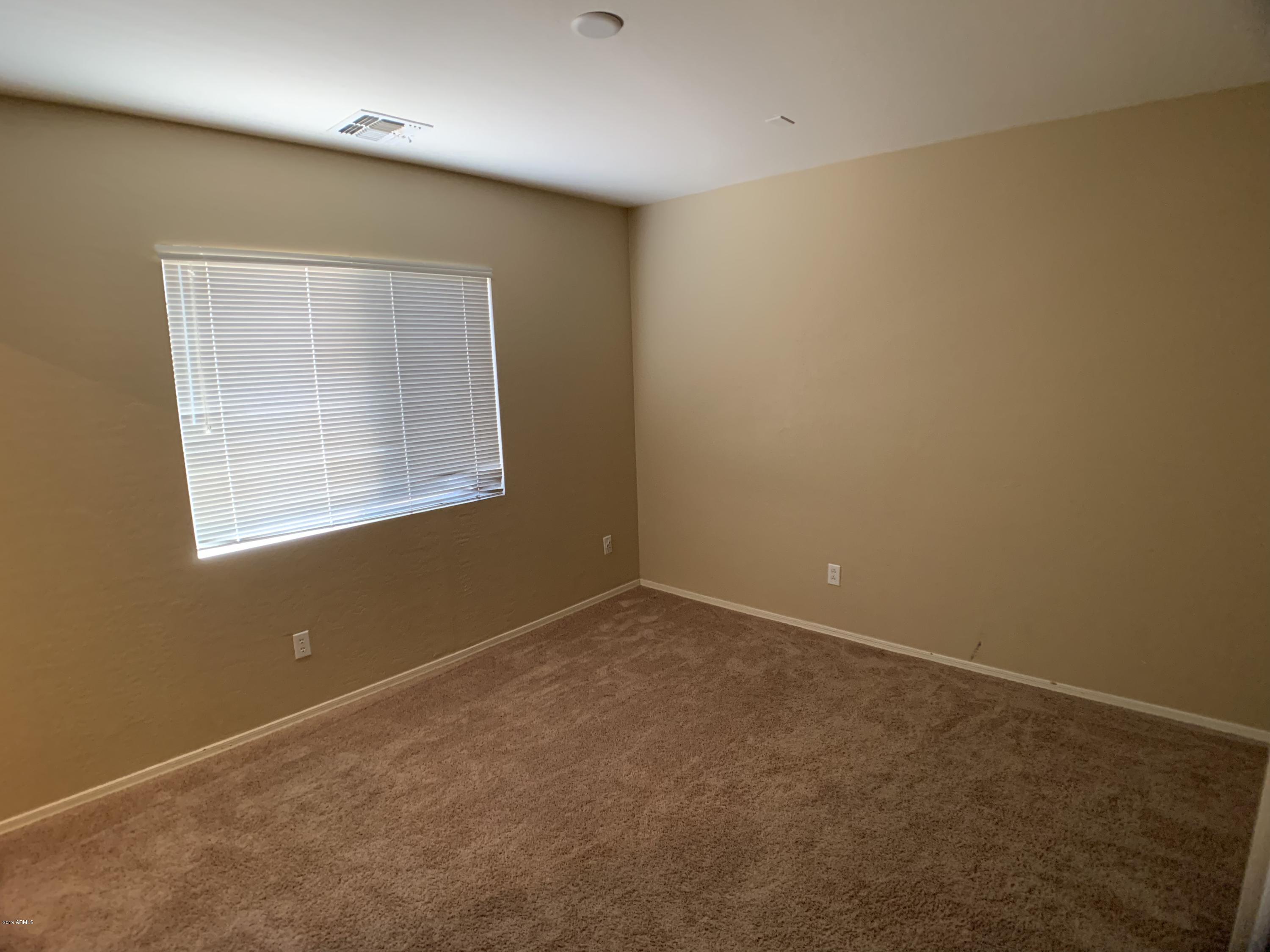 3952 East Morenci Road San Tan Valley, AZ 85143 - Photo 11 of 15 an empty room with windows