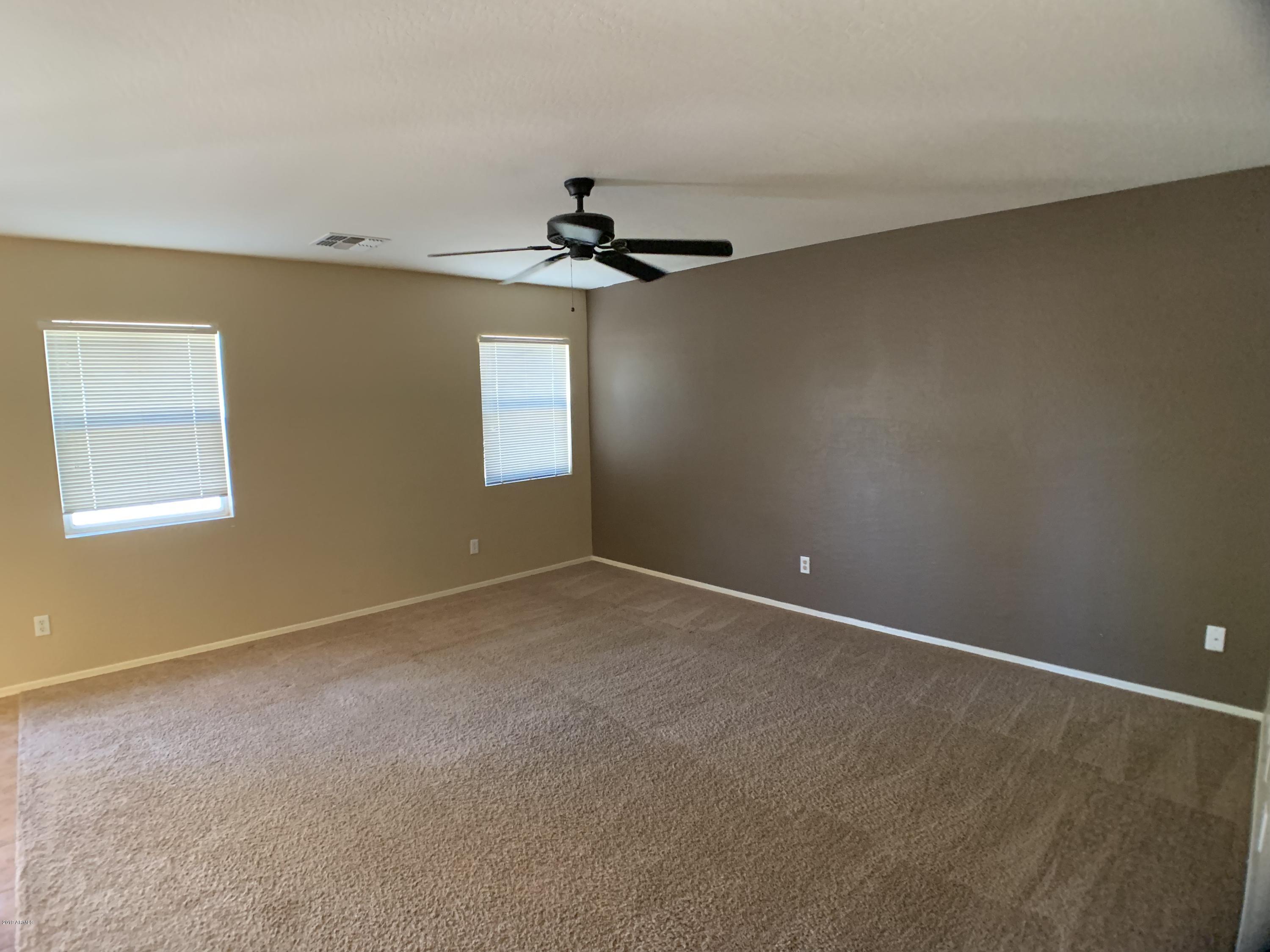 3952 East Morenci Road San Tan Valley, AZ 85143 - Photo 4 of 15 a view of an empty room with a window