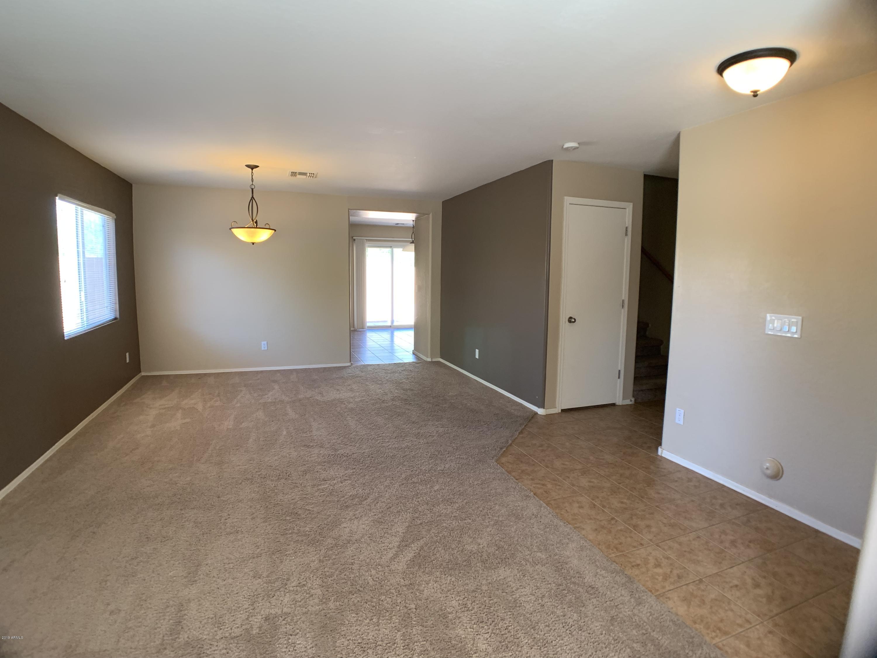 3952 East Morenci Road San Tan Valley, AZ 85143 - Photo 5 of 15 an empty room with windows and entrance