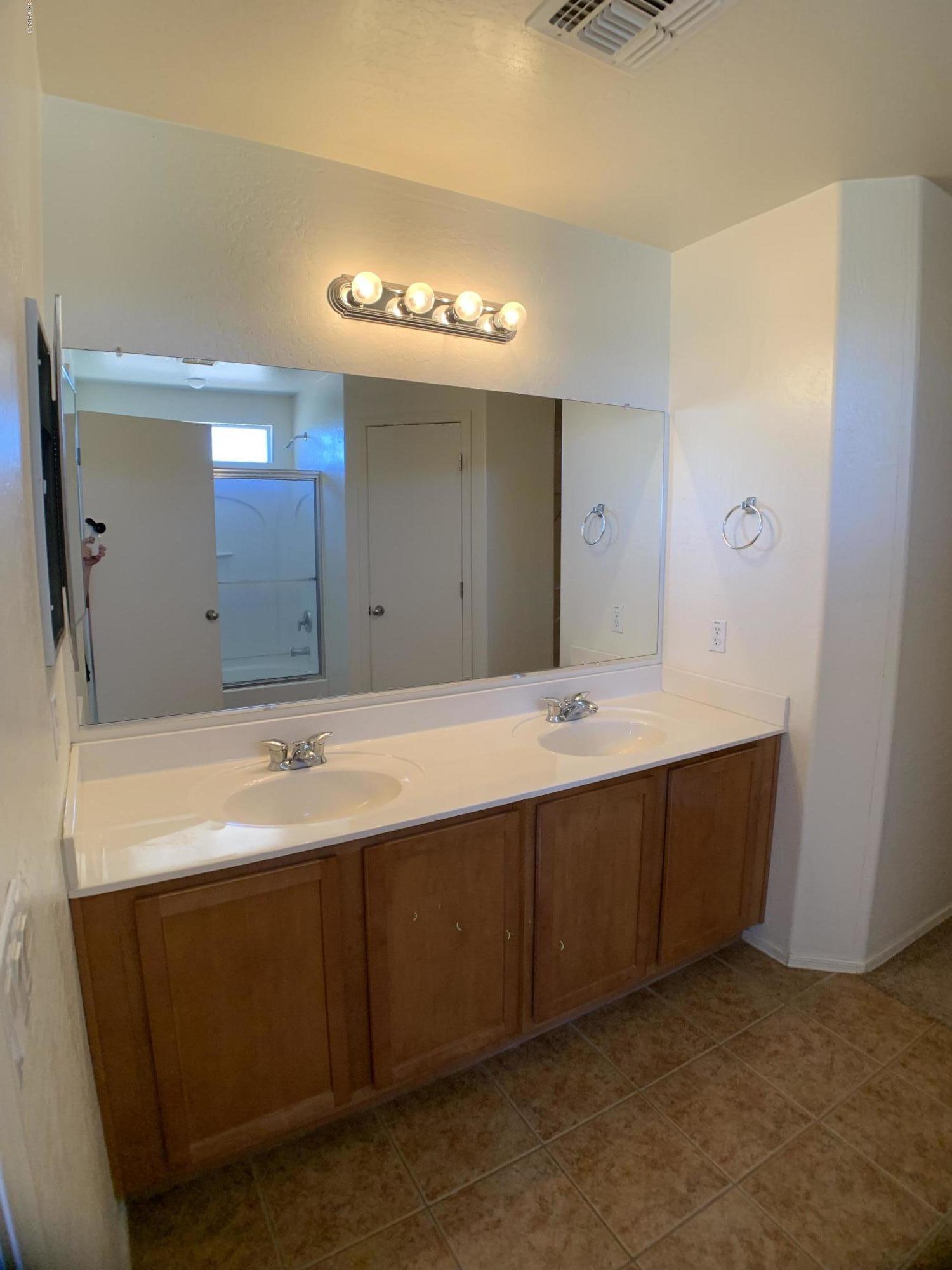 3952 East Morenci Road San Tan Valley, AZ 85143 - Photo 8 of 15 a bathroom with a sink and a mirror
