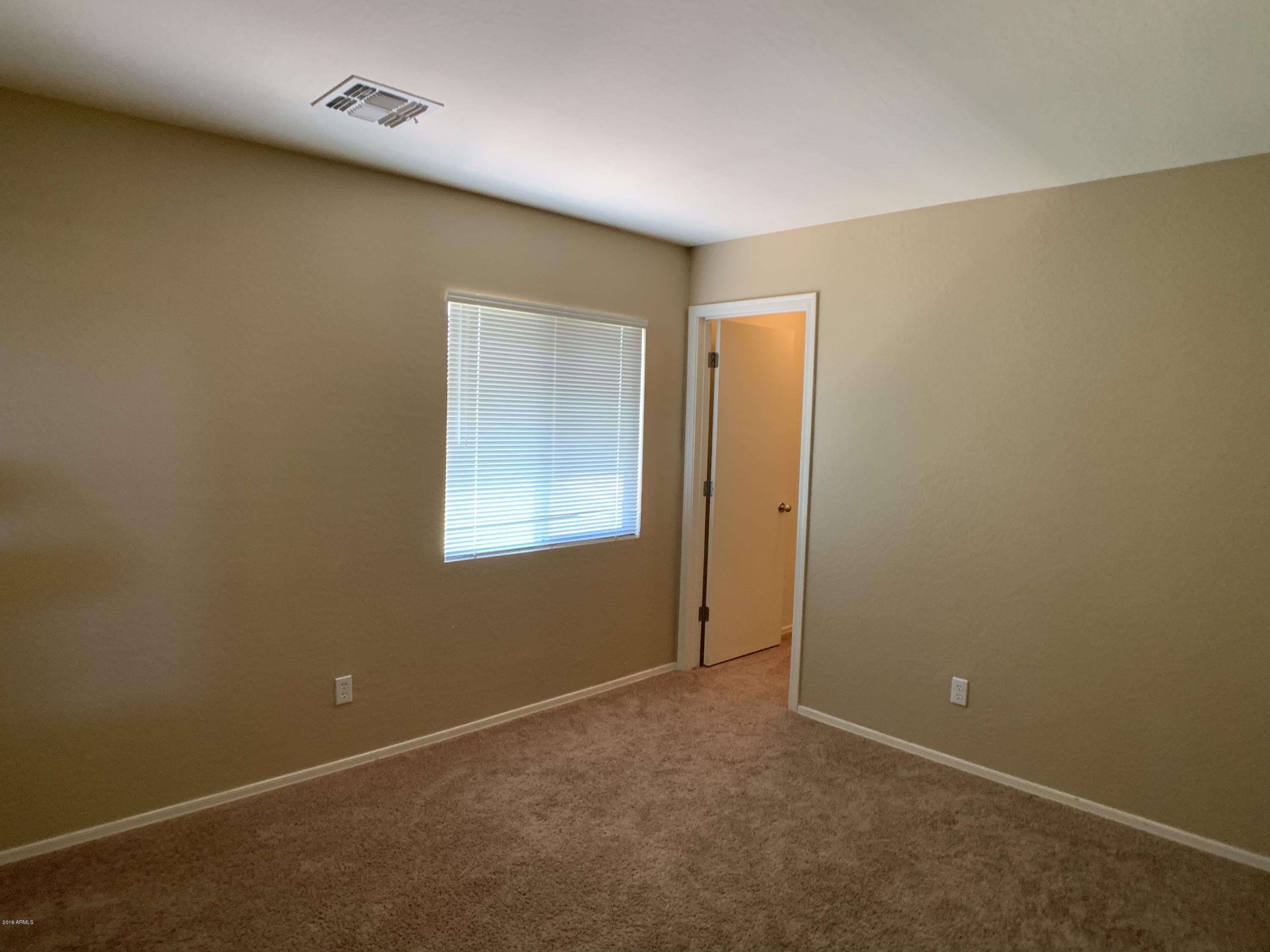 3952 East Morenci Road San Tan Valley, AZ 85143 - Photo 10 of 15 an empty room with windows