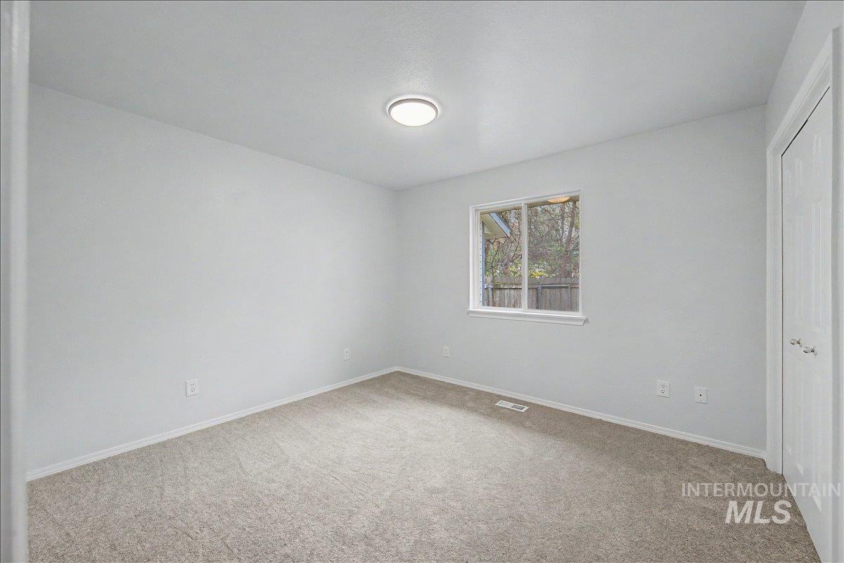 2501 West Hill Road Boise, ID 83702 - Photo 18 of 31 Unfurnished bedroom with a closet and light carpet
