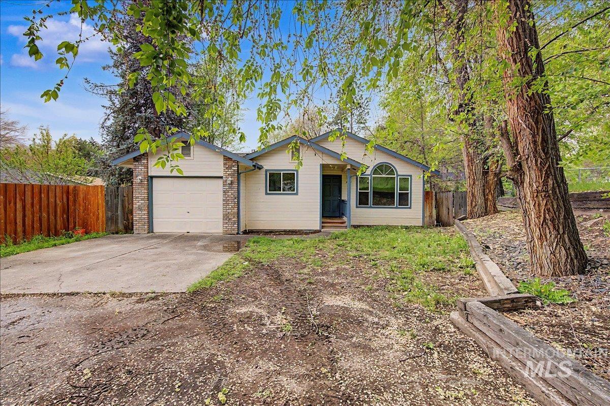 2501 West Hill Road Boise, ID 83702 - Photo 2 of 31 Single story home with a garage, driveway, and brick siding