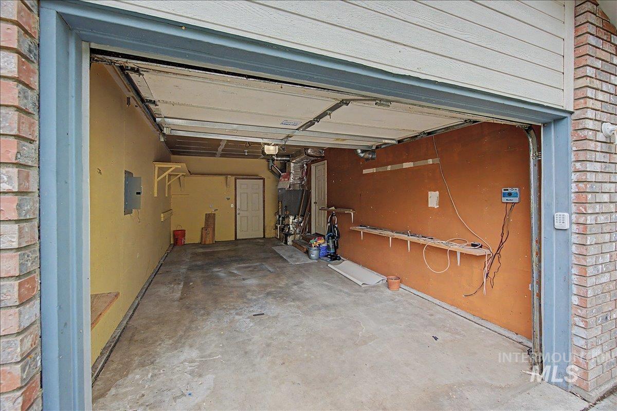 2501 West Hill Road Boise, ID 83702 - Photo 25 of 31 Garage with electric panel and heating unit