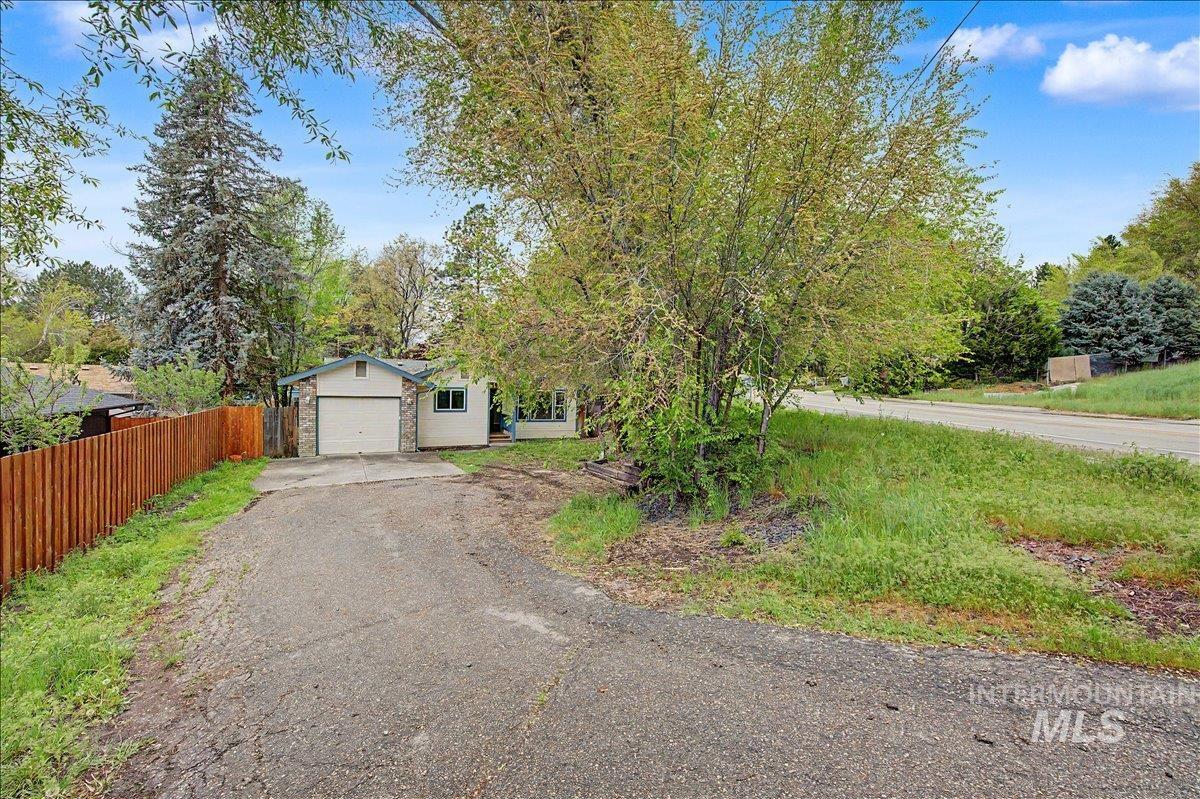 2501 West Hill Road Boise, ID 83702 - Photo 3 of 31 View of front of home featuring asphalt driveway and a garage