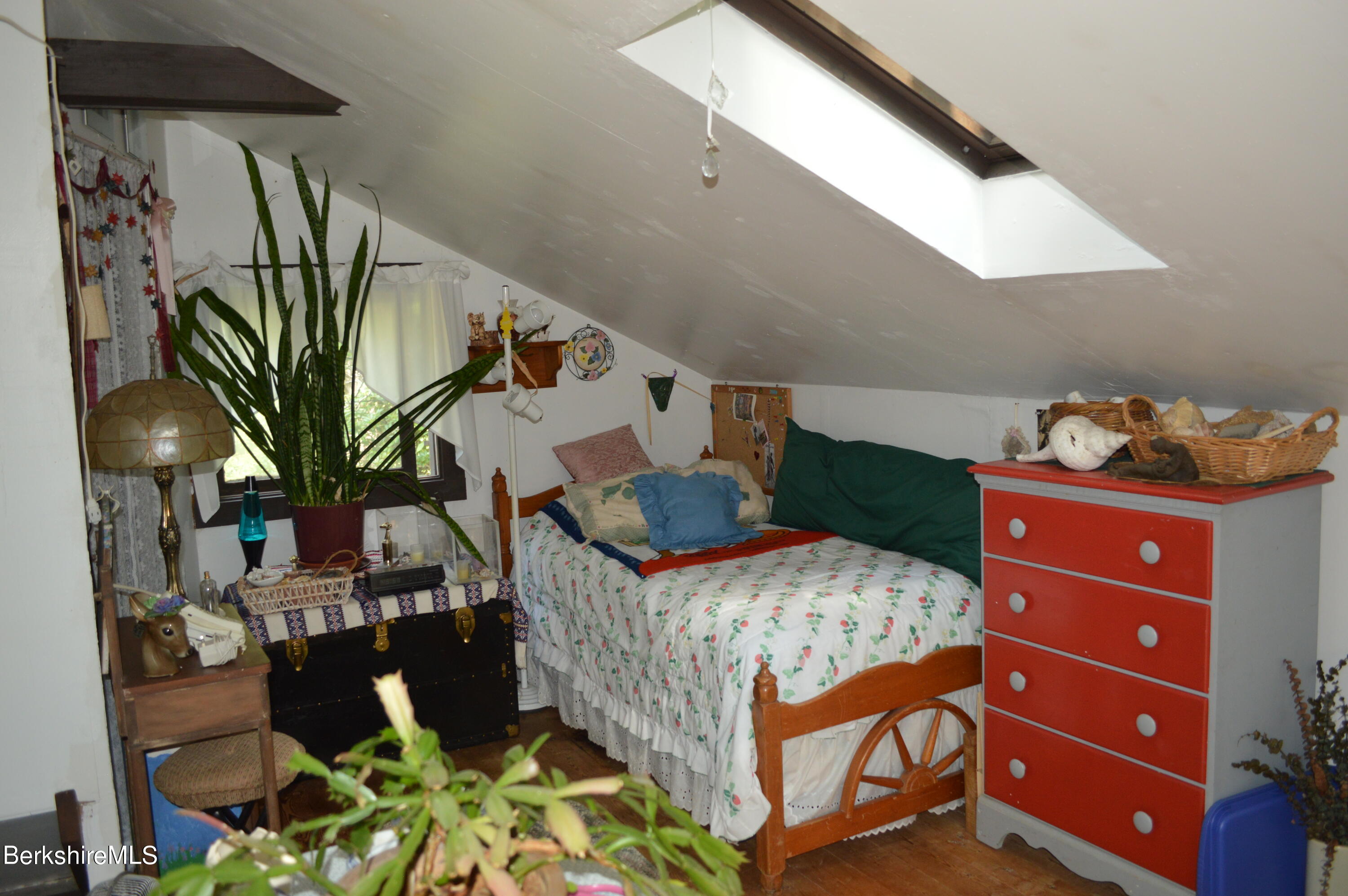 473 County Road Becket, MA 01223 - Photo 13 of 30 a bedroom with a bed and a chandelier
