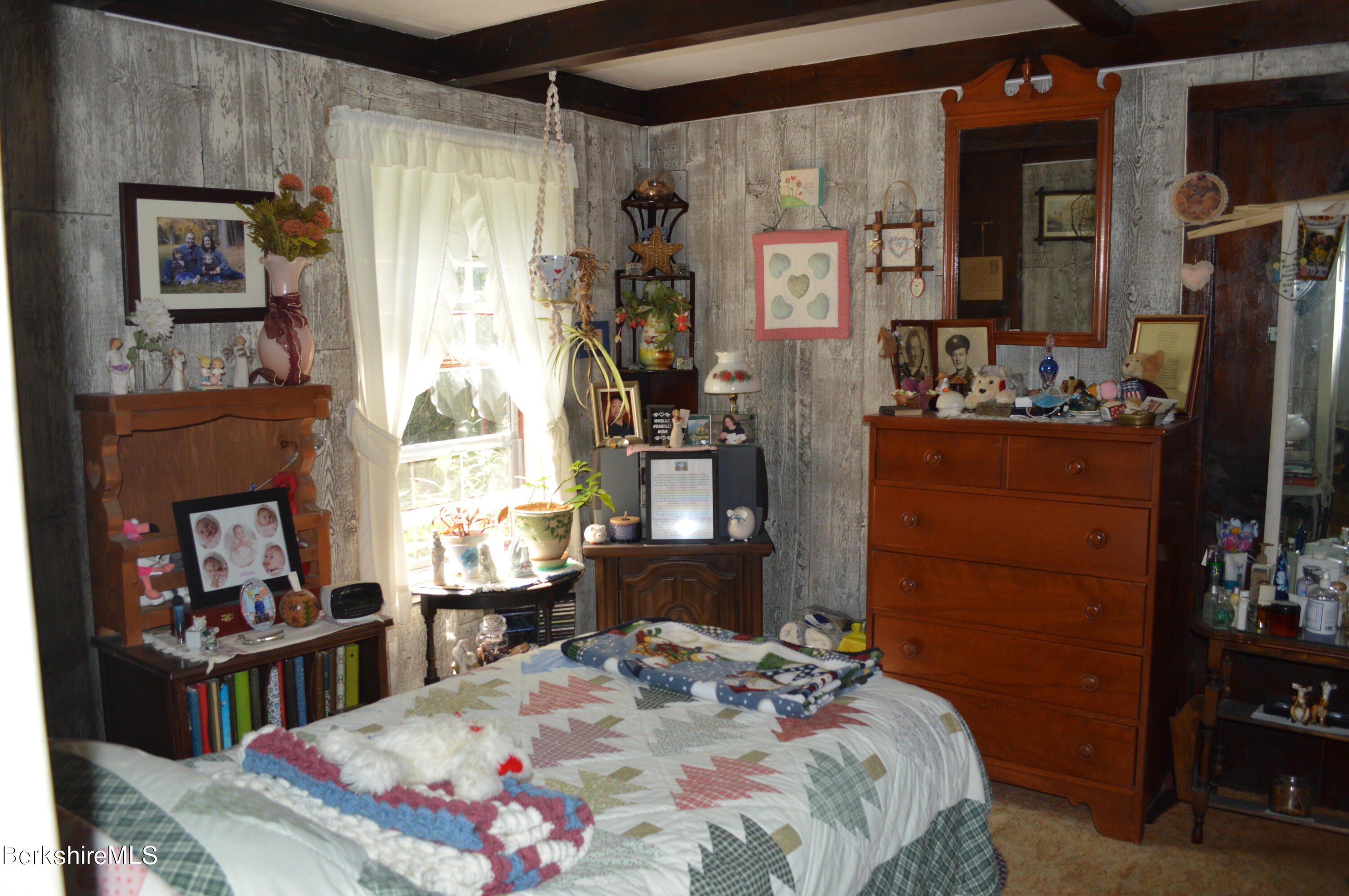 473 County Road Becket, MA 01223 - Photo 16 of 30 a bedroom with a bed a dresser and next to a window