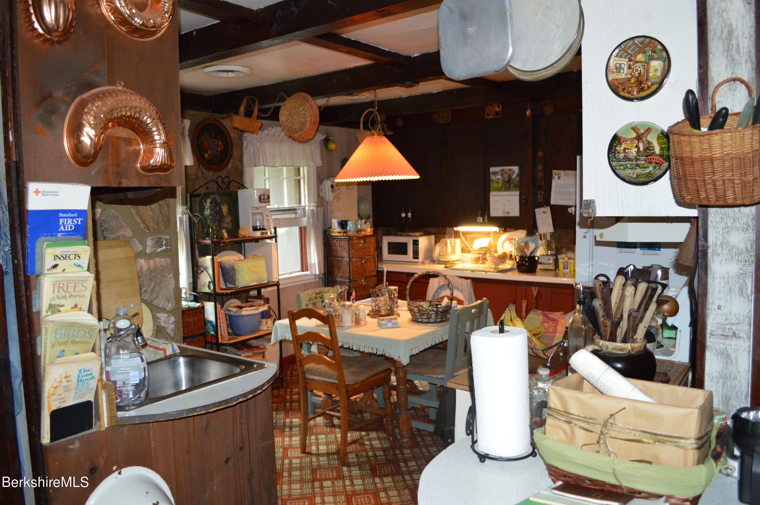 473 County Road Becket, MA 01223 - Photo 18 of 30 a dining room with furniture clock and wall painting