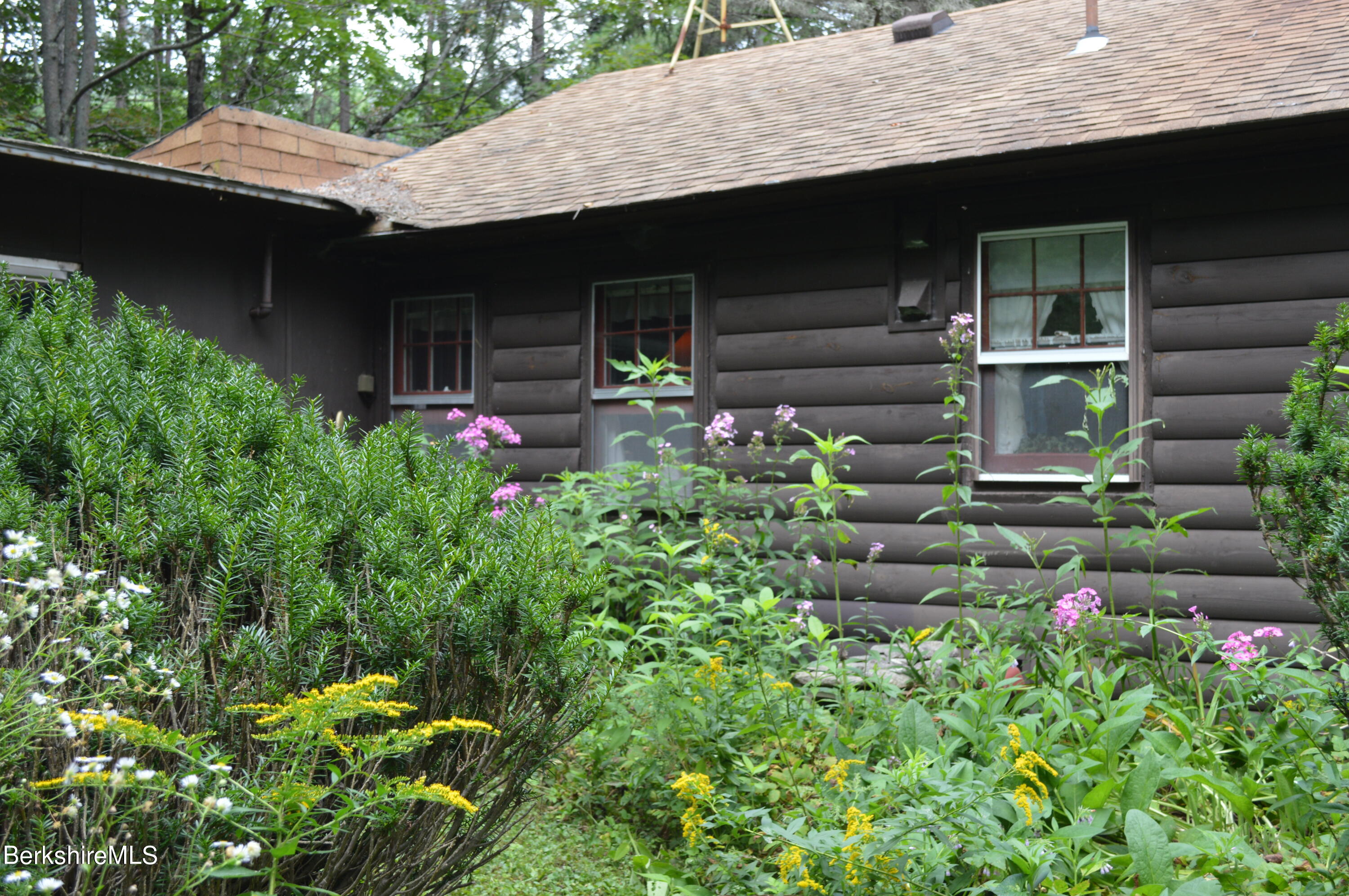 473 County Road Becket, MA 01223 - Photo 27 of 30 a backyard of a house with lots of green space