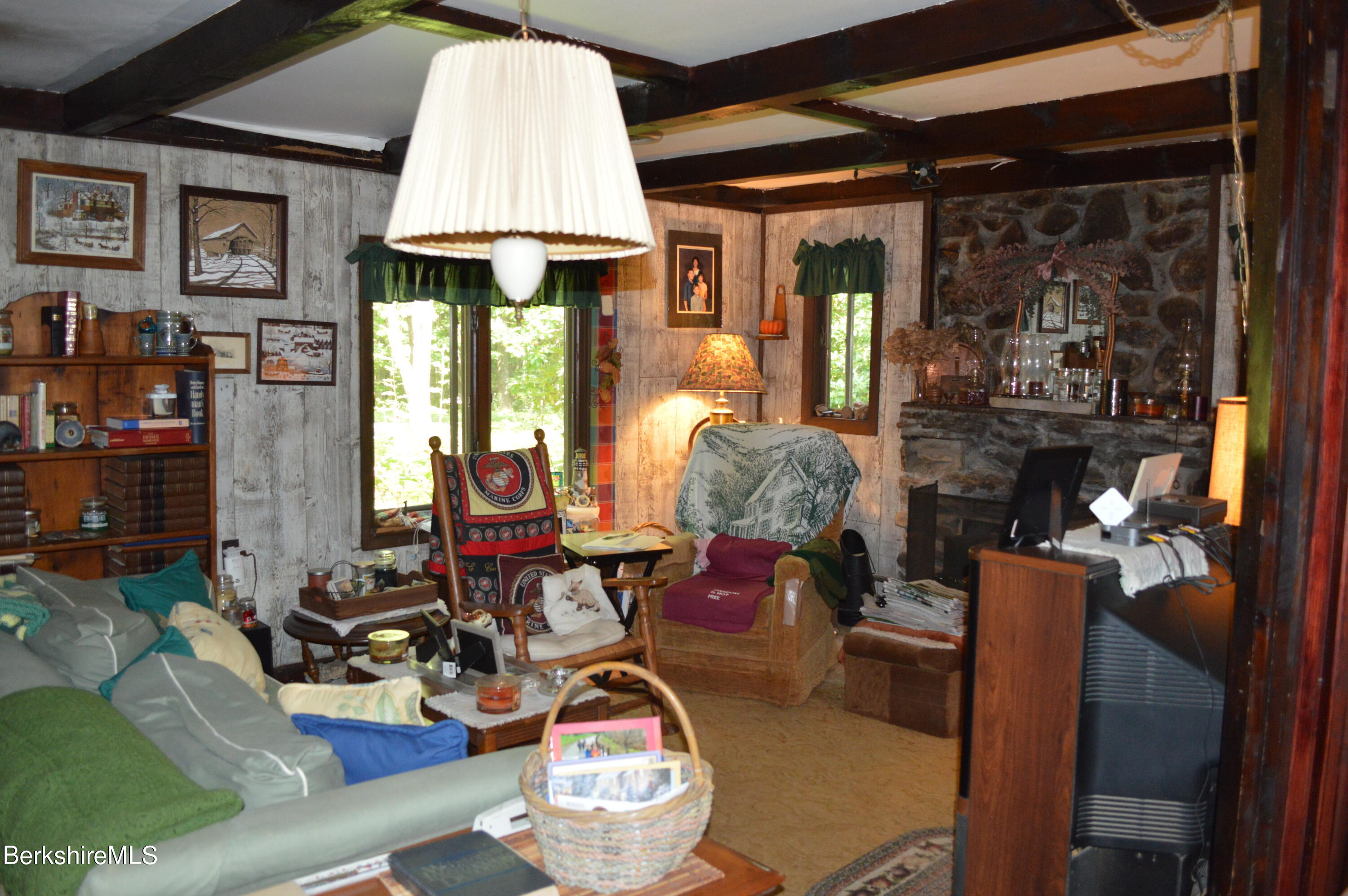 473 County Road Becket, MA 01223 - Photo 4 of 30 a room with furniture and a chandelier