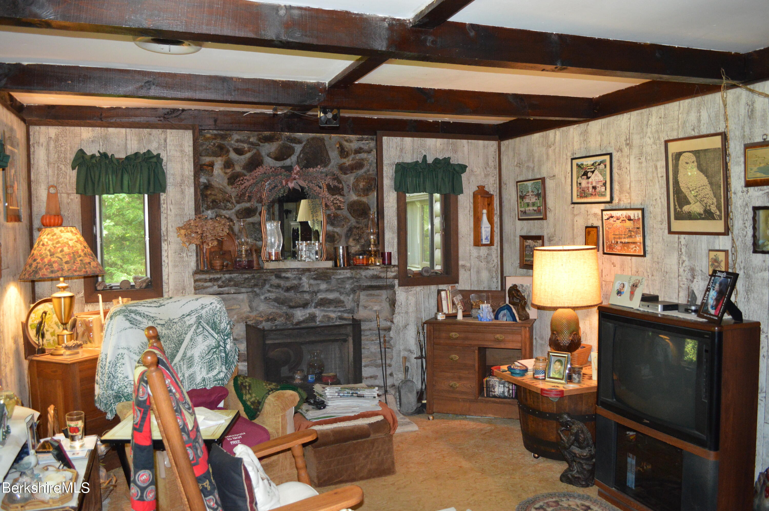 473 County Road Becket, MA 01223 - Photo 8 of 30 a living room with fireplace furniture and a flat screen tv