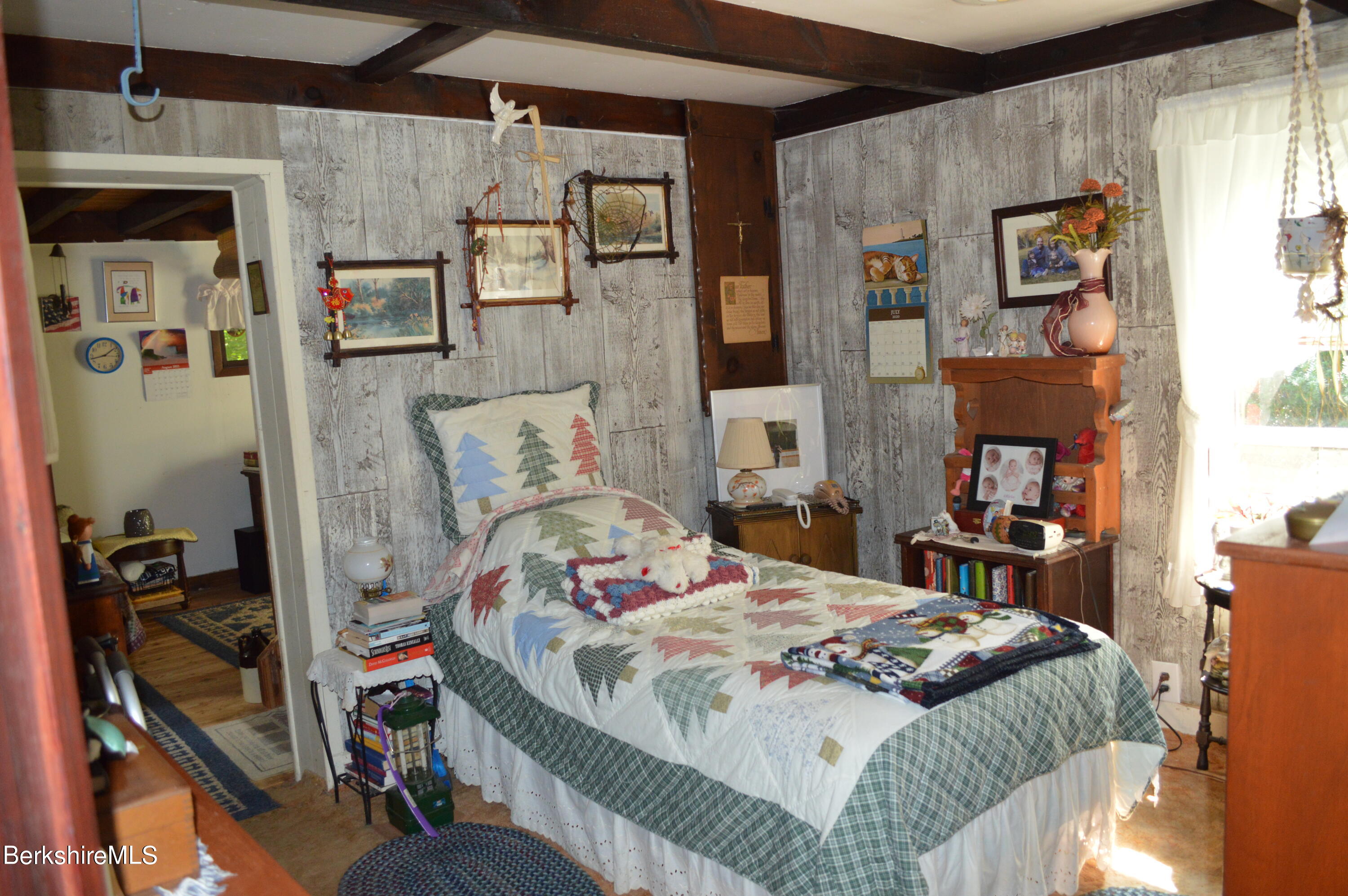 473 County Road Becket, MA 01223 - Photo 9 of 30 a bedroom with a bed and wooden floor