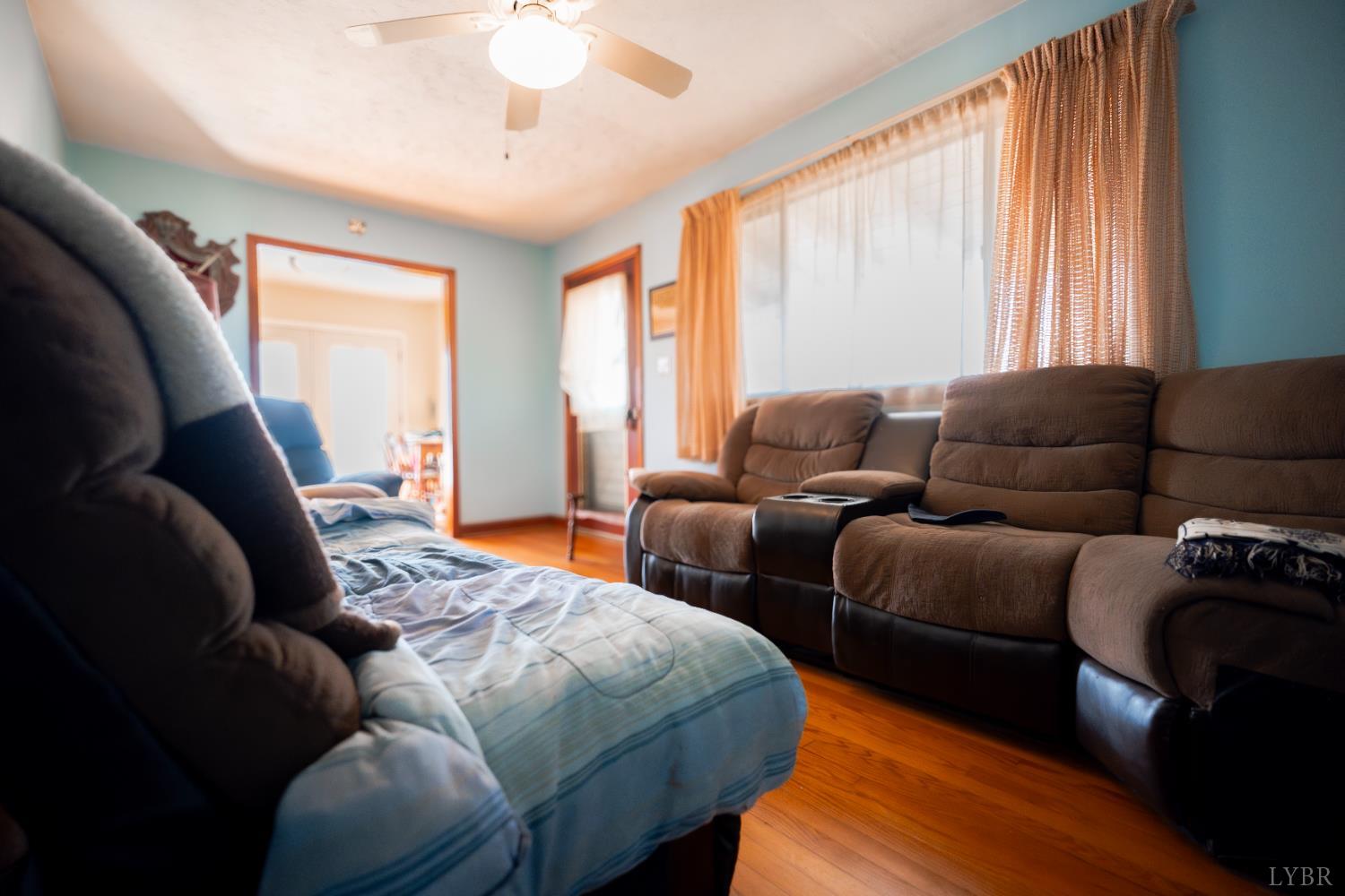 1228 Clover Creek Road Huddleston, VA 24104 - Photo 13 of 25 a bedroom with furniture and a large window