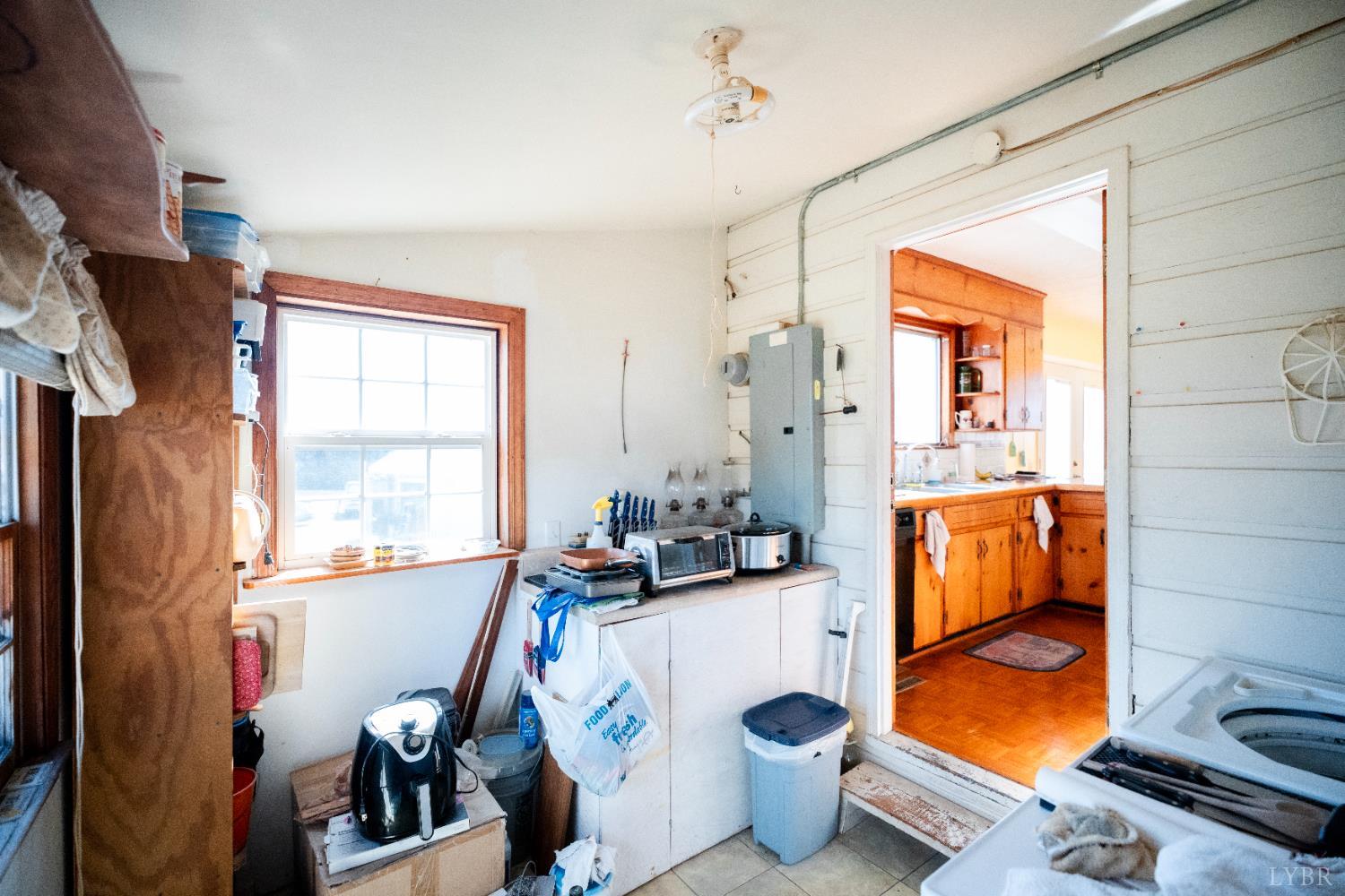 1228 Clover Creek Road Huddleston, VA 24104 - Photo 18 of 25 a very nice looking room with a large window and couch