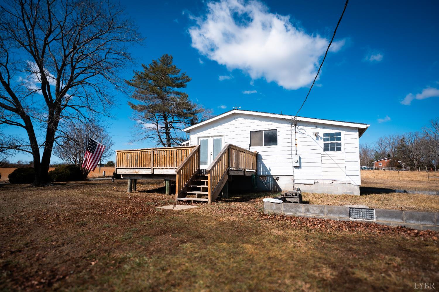 1228 Clover Creek Road Huddleston, VA 24104 - Photo 2 of 25 a view of a house with a yard