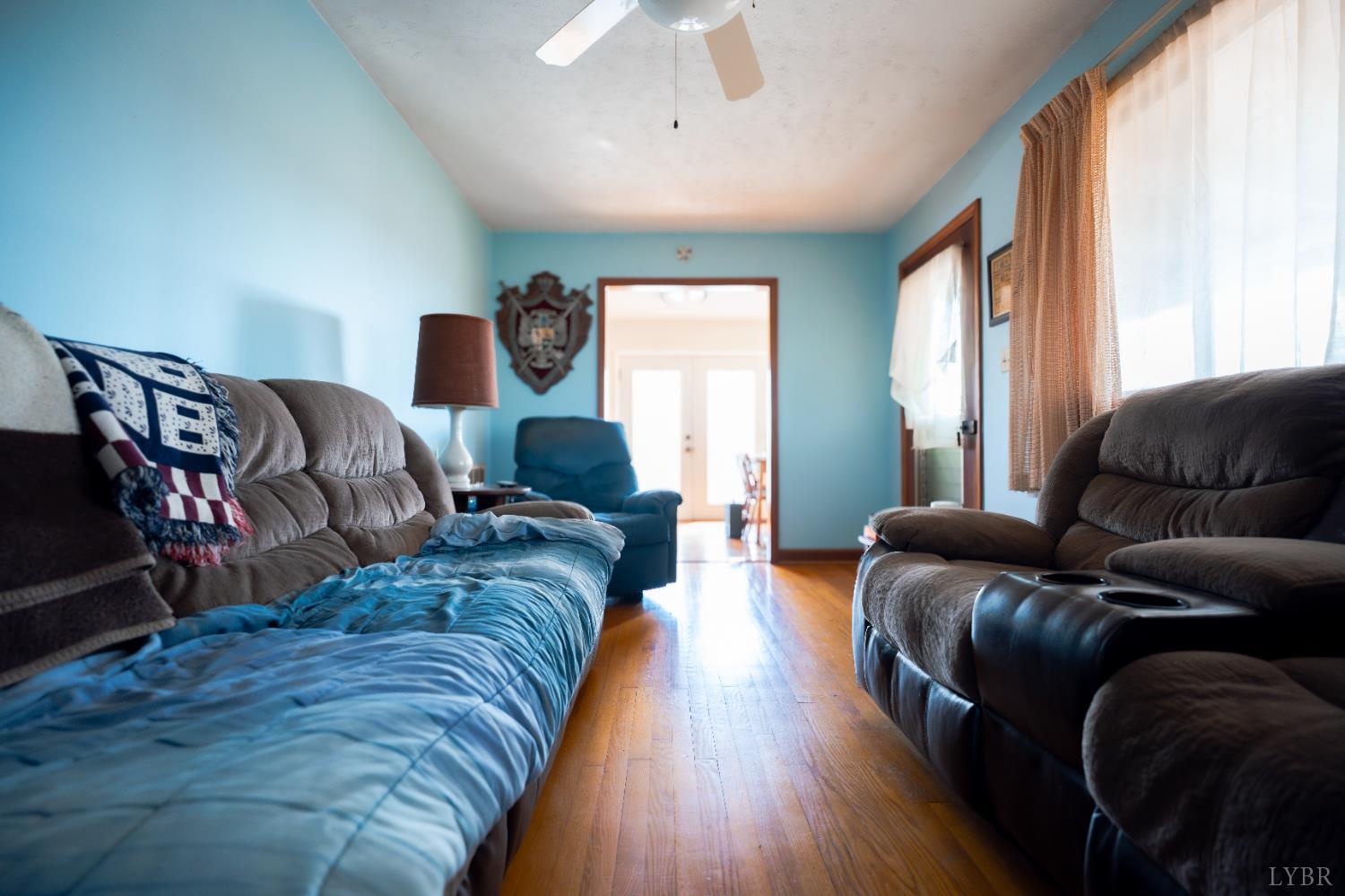 1228 Clover Creek Road Huddleston, VA 24104 - Photo 8 of 25 a living room with furniture and wooden floor