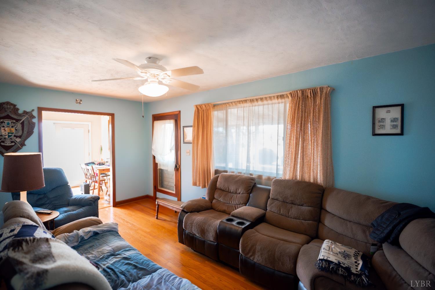 1228 Clover Creek Road Huddleston, VA 24104 - Photo 10 of 25 a living room with furniture and a large window