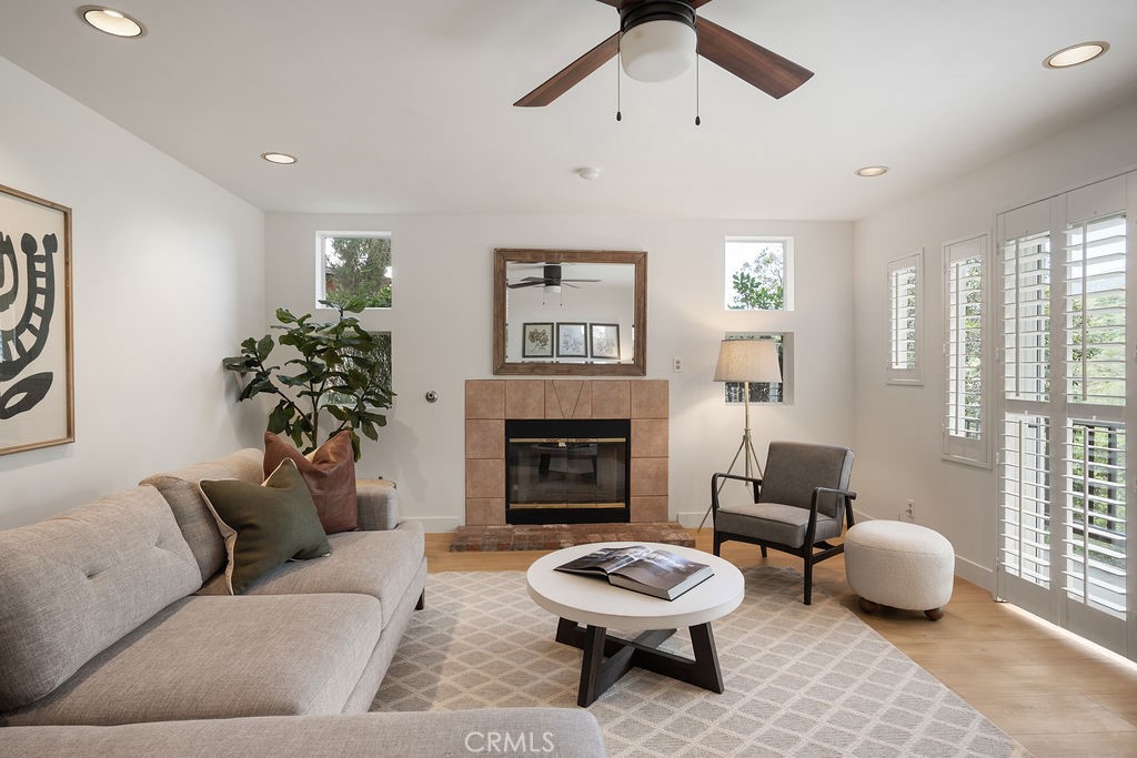 235 Spinks Canyon Road Duarte, CA 91010 - Photo 16 of 50 a living room with furniture a fireplace and a large window