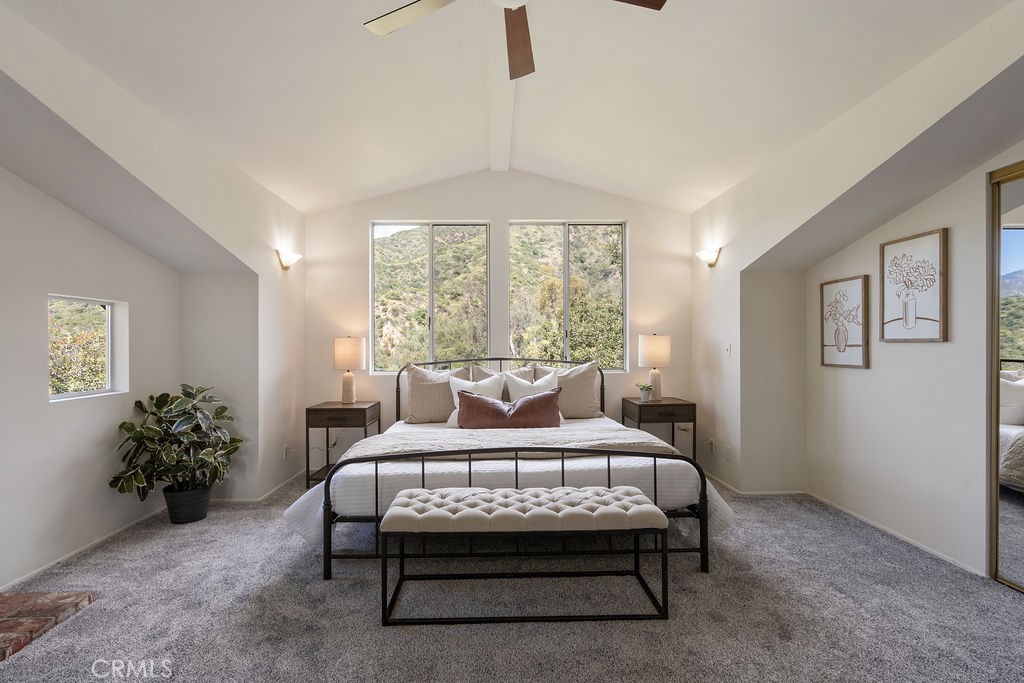 235 Spinks Canyon Road Duarte, CA 91010 - Photo 25 of 50 a large bedroom with a bed and a potted plant