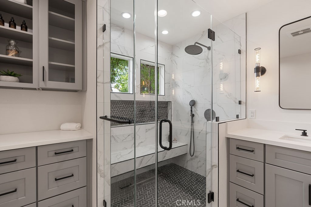 235 Spinks Canyon Road Duarte, CA 91010 - Photo 32 of 50 a bathroom with a shower sink and mirror