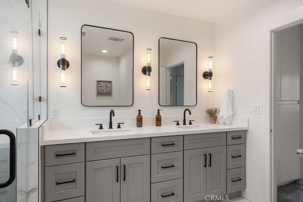 235 Spinks Canyon Road Duarte, CA 91010 - Photo 33 of 50 a bathroom with a double vanity sink mirror and