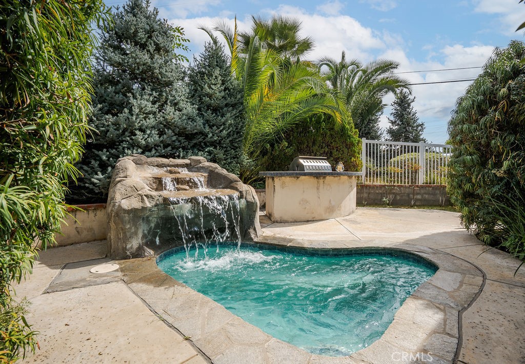 235 Spinks Canyon Road Duarte, CA 91010 - Photo 34 of 50 a view of a yard with plants and a fountain