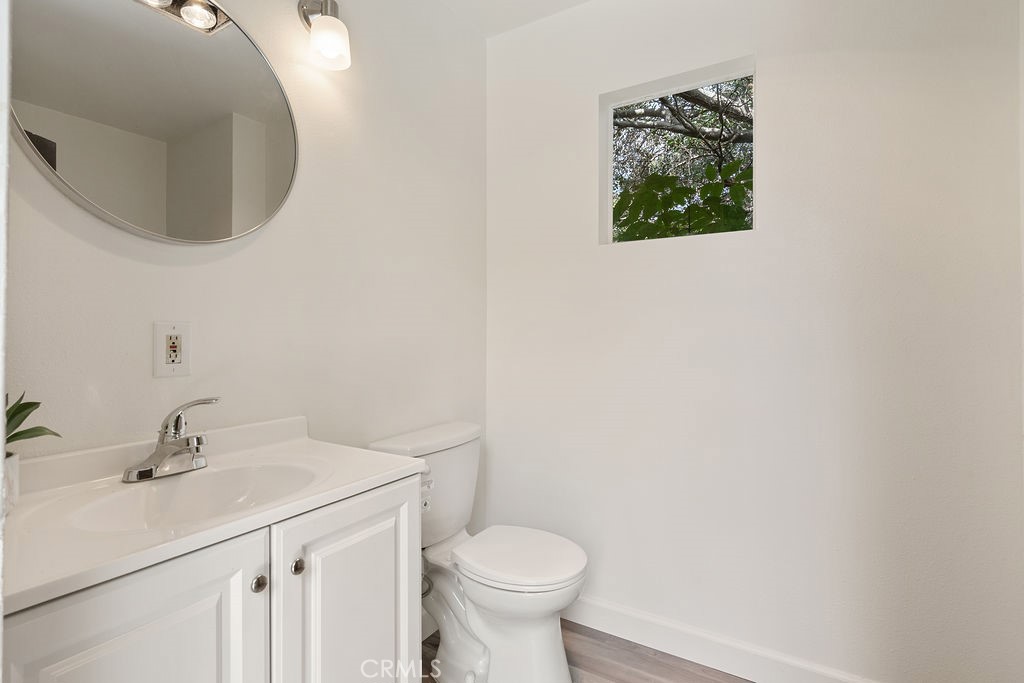 235 Spinks Canyon Road Duarte, CA 91010 - Photo 38 of 50 a bathroom with a toilet sink and mirror