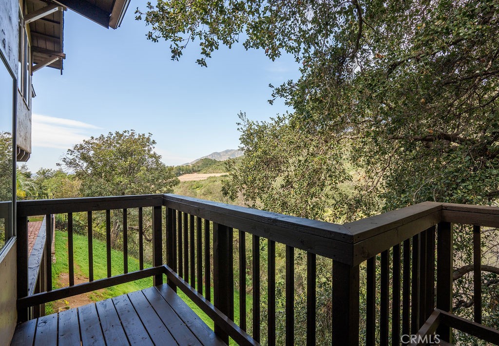 235 Spinks Canyon Road Duarte, CA 91010 - Photo 39 of 50 a balcony with wooden floor and fence