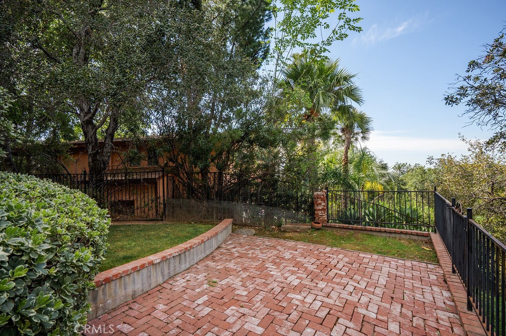 235 Spinks Canyon Road Duarte, CA 91010 - Photo 42 of 50 a view of a yard with plants and a bench