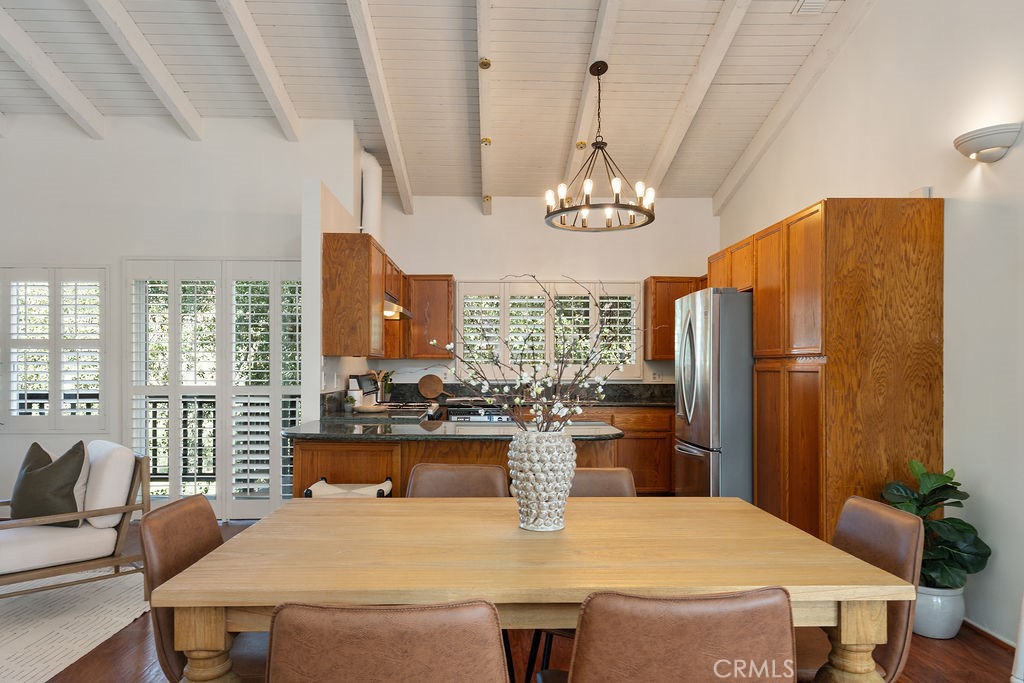 235 Spinks Canyon Road Duarte, CA 91010 - Photo 7 of 50 a view of a dining room with furniture a chandelier and large windows