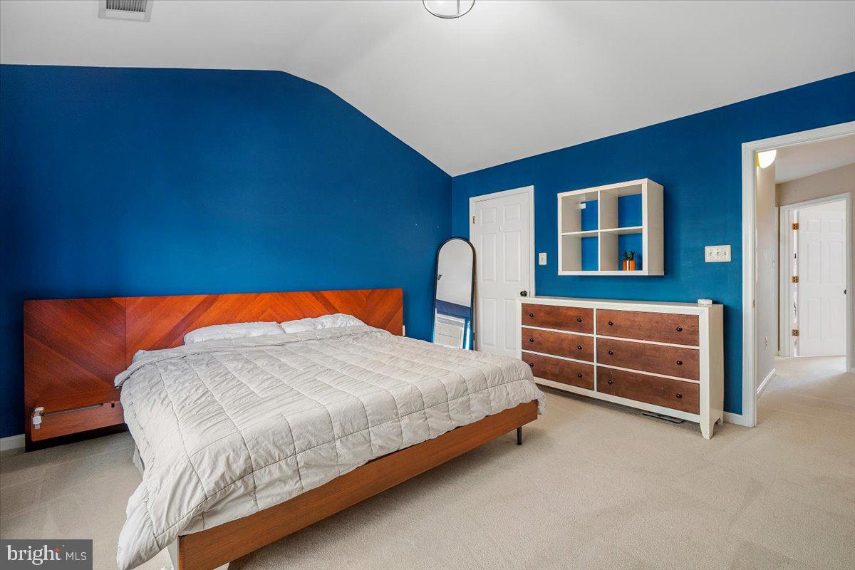 22019 Box Car Square Sterling, VA 20166 - Photo 15 of 31 a bedroom with a bed and dresser