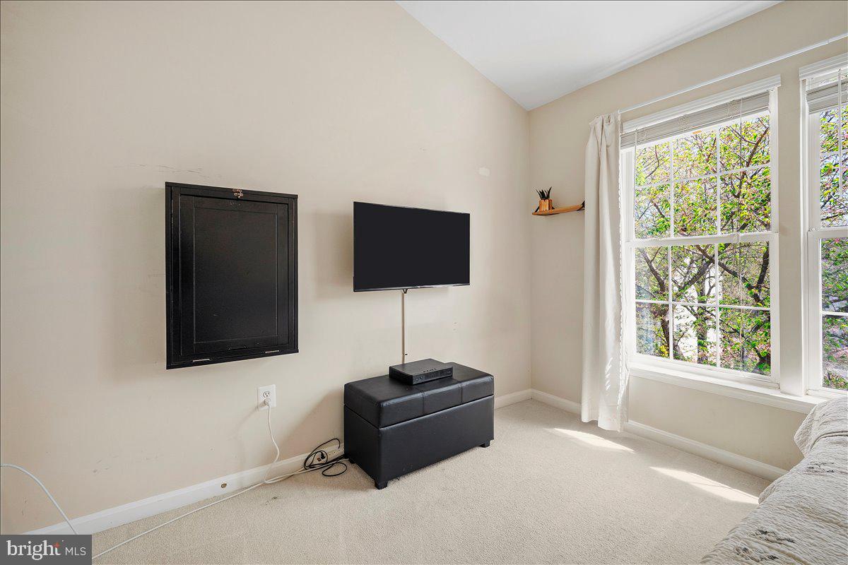 22019 Box Car Square Sterling, VA 20166 - Photo 22 of 31 a living room with a flat screen tv and a window