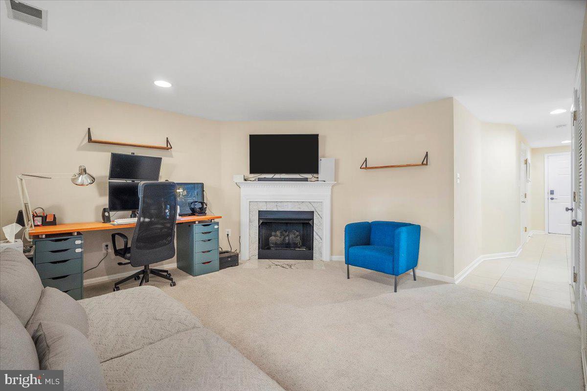 22019 Box Car Square Sterling, VA 20166 - Photo 25 of 31 a living room with furniture a fireplace and a flat screen tv