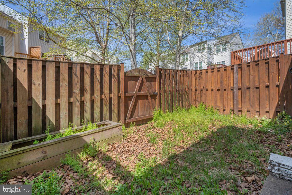 22019 Box Car Square Sterling, VA 20166 - Photo 26 of 31 a view of small yard with wooden fence