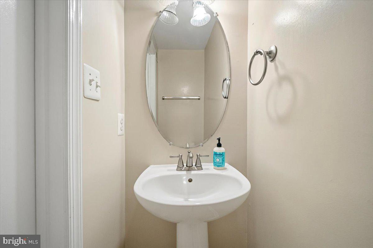 22019 Box Car Square Sterling, VA 20166 - Photo 27 of 31 a bathroom with a sink and a mirror