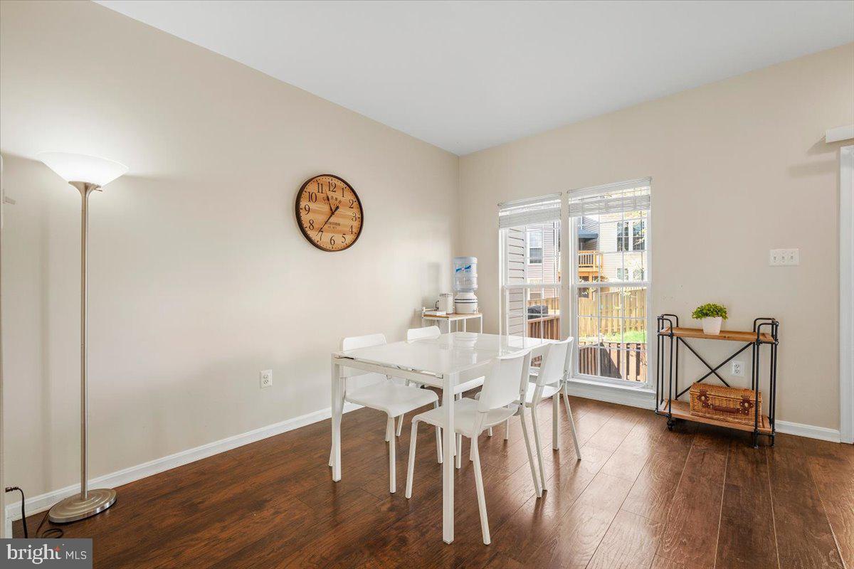 22019 Box Car Square Sterling, VA 20166 - Photo 7 of 31 a view of a dining room with furniture and wooden floor