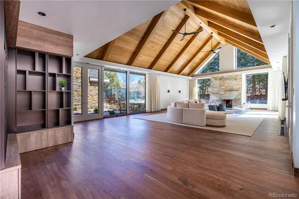 a living room with furniture rug and window