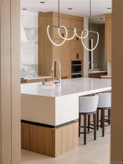 a bedroom with a large bed and a flat tv screen