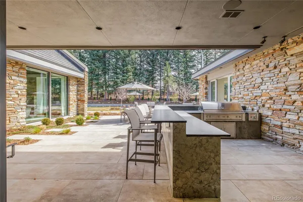 a bathroom with a double vanity sink and a large mirror