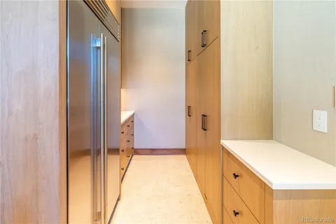 a spacious bedroom with a large bed and a wooden floor