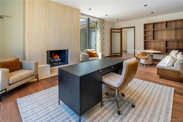 a view of a water fountain and a bench