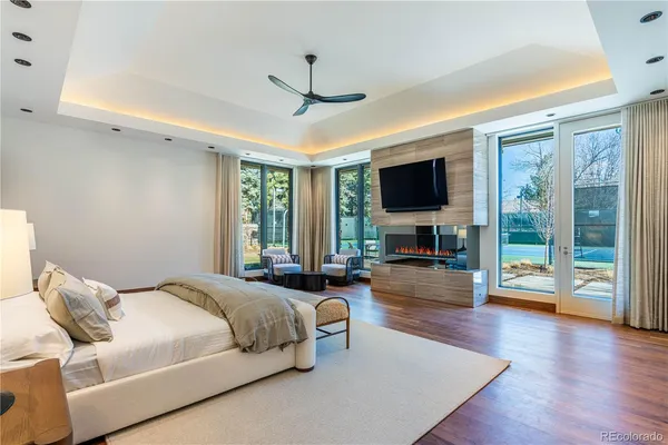 a living room with pool table and a flat screen tv