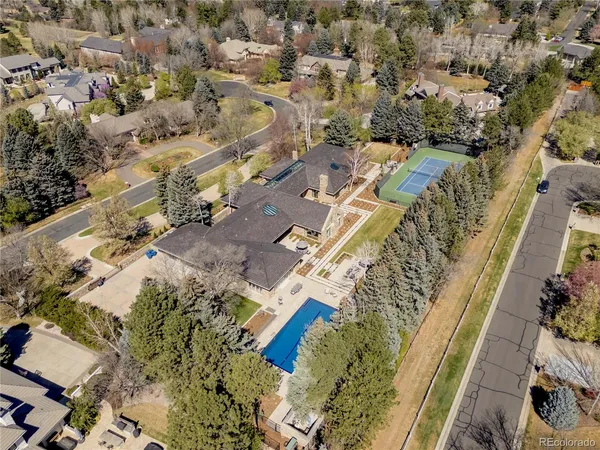 a living room with furniture a flat screen tv and a floor to ceiling window