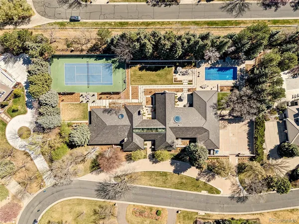 a living room with a large window and furniture