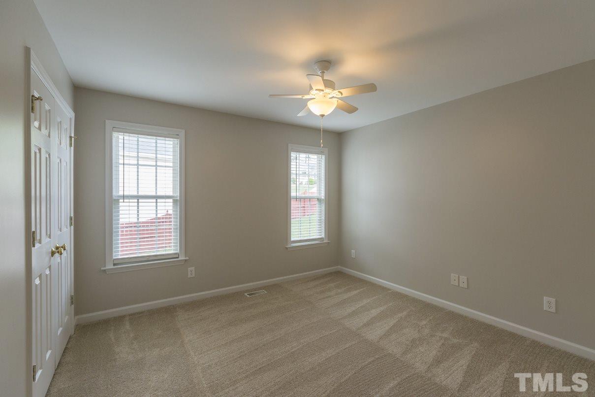 826 Shackleton Road Apex, NC 27502 - Photo 17 of 24 a view of an empty room with a window
